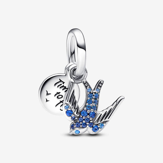 A two-in-one charm with a sparkling swallow and a message card